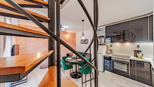 a kitchen and dining room with a loft conversion at Villa Anna by Villas Guide in Vela Luka