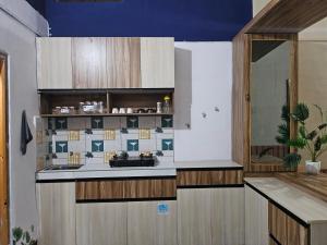 a kitchen with a sink and a counter at The Glory Apartment room 1 in Imphal
