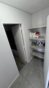 a room with an open door to a refrigerator at Pardelas playa y ballenas in Puerto Madryn