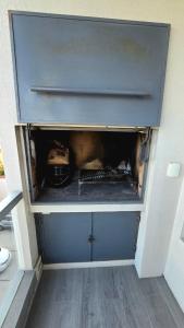 an open drawer of a refrigerator at Pardelas playa y ballenas in Puerto Madryn +4 photos