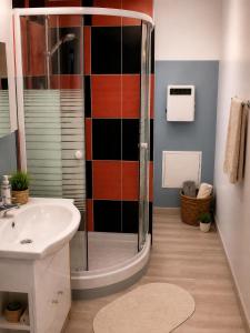 a bathroom with a shower and a sink at L'oiseau bleu in Salin-de-Giraud +38 photos
