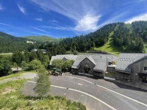 an aerial view of a house in the mountains at Duplex T4 residence les Etoiles du Sud in Le Lioran
