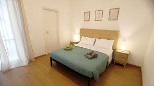 a bedroom with a bed with two stuffed animals on it at Civico 16 in Sulmona