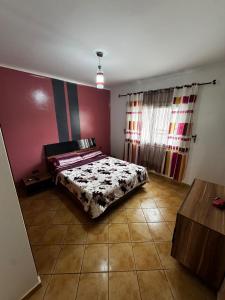 a bedroom with a bed in the corner of a room at Peaceful Haven with Pool, Breathtaking View in Oued Laou +25 photos