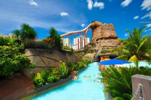 a water slide at the disneyland resort at Spazzio Diroma Com acesso ao Acqua Park in Caldas Novas