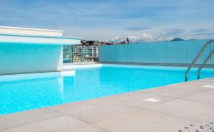 a swimming pool on the roof of a building at Nemea Appart Hotel Sunset Nice Arenas in Nice
