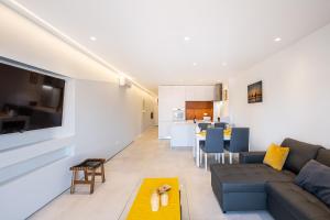 a living room with a couch and a table at #081 1BR Vale Mangude Pool & Location in Albufeira