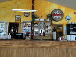 a bar in a restaurant with a counter top at Kanslarinn Hostel in Hella