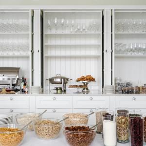 a kitchen with many bowls of food on a counter at Siglo Hotel by Keahotels in Siglufjörður +88 photos