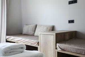 a room with two bunk beds and a mirror at Hestheimar in Hella