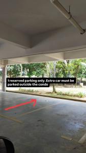 a sign in a parking garage that reads i interviewed parking only extra car must be at Singgah homestay saujana aster in Putrajaya