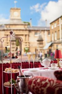 a table with glasses of champagne and food on it at Rubens At The Palace in London +131 photos