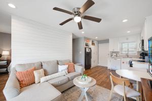 a living room with a couch and a ceiling fan at Bay Tree B3 in Port Aransas