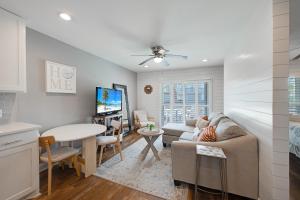 a living room with a couch and a table at Bay Tree B3 in Port Aransas