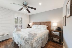 a bedroom with a bed and a ceiling fan at Bay Tree B3 in Port Aransas