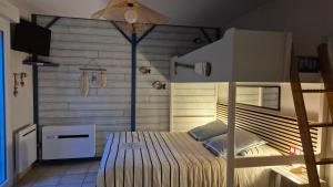 a bedroom with a bunk bed in a room at Chez Florence et Bruno in Saint-Cyr-sur-Mer +67 photos