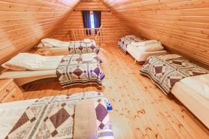 a room with six beds in a wooden cabin at Brimnes Bungalows in Ólafsfjörður