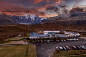 an aerial view of a building with cars in a parking lot at Hotel Skaftafell in Skaftafell