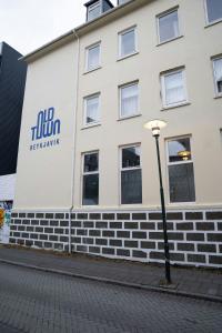a building with a sign on the side of it at Old Town Reykjavik in Reykjavík +116 photos
