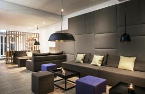 a living room with a couch and a table at Storm Hotel by Keahotels in Reykjavík