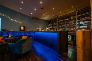 a bar with blue lighting in a restaurant at Hotel Laki in Kirkjubæjarklaustur