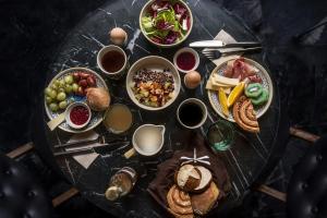 a glass table with plates of food on it at Axel Guldsmeden in Copenhagen