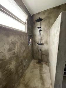 a bathroom with a window and a light fixture at Casa Baía da Lagoa in Lagoa +15 photos