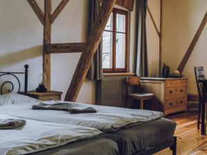 a bedroom with two beds and a window at Dom Sokolik in Trzcińsko