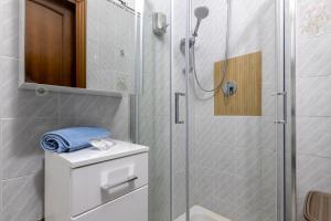 a bathroom with a shower with a toilet and a sink at Cuncordu Affittacamere- Sassari in Sassari +46 photos