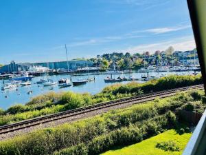 a view of a marina with boats in the water at Island Point Horizon View in Lymington
