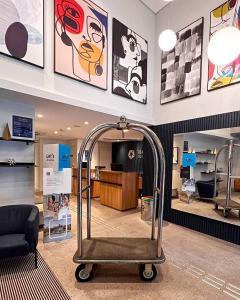 a waiting room with a luggage cart in a store at Transamerica Executive Bela Cintra (Paulista) in São Paulo +32 photos