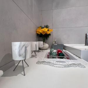 a bathroom with a sink and a tub and a mirror at Spacious King En Suite in St. Albans