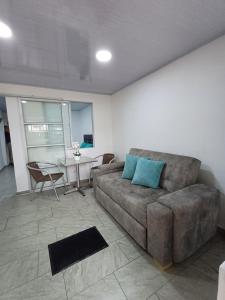 a living room with a couch and a table at APARTA ESTUDIO CONDO in Villavicencio