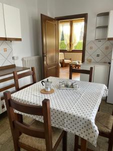 a kitchen with a table with a white table cloth at Casa dell'OCA in Viganò