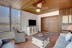 a living room with a couch and a tv at Beachhead Unit 5 BH5 in Port Aransas
