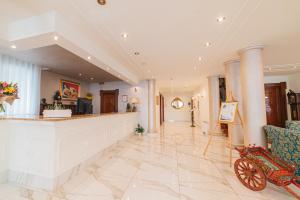 a lobby of a hotel with a reception counter at Hotel Terme Roma in Abano Terme +95 photos