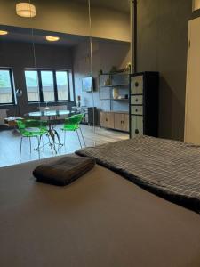 a bedroom with a bed and a table and chairs at Smartstay Porta in Porta Westfalica