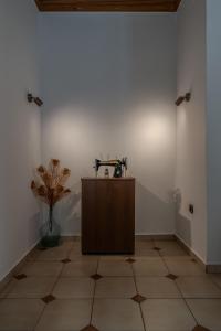a room with a sink on a tiled floor at Sofia's Sea View House in Ágios Dimítrios