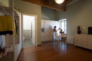a man taking a picture of a kitchen with a table at Hotel Ristorante Fontana in Calestano +13 photos