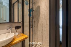 a bathroom with a sink and a shower at Taksim Avenue in Istanbul +34 photos