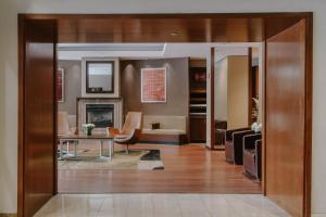 a living room with a couch and a table at Club Quarters Hotel Central Loop, Chicago in Chicago