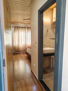 a bathroom with a sink and a mirror at Saadhan Homestay in Mussoorie