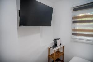 a blackboard hanging on a white wall in a room at Hostale Blas Cabrera Madrid in Madrid