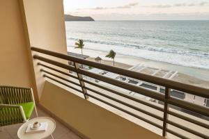 a balcony with a view of the beach at Iberostar Selection Playa Mita - All Inclusive in Punta Mita