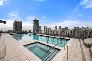 a swimming pool on the roof of a building at 501 First Residences by Palermo Home Miami in Miami