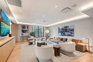 a living room with a couch and a table at 501 First Residences by Palermo Home Miami in Miami