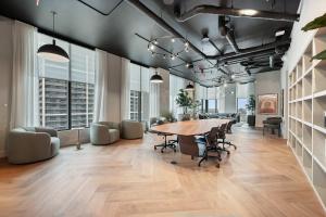 an office with a long table and chairs and windows at 501 First Residences by Palermo Home Miami in Miami +290 photos