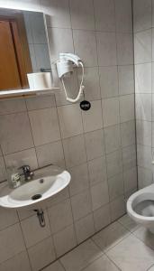 a bathroom with a sink and a toilet at Shirdel Pension in Gaimersheim +26 photos