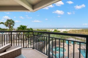 a balcony with a view of the beach at Gulf Strand Resort by Travel Resort Services in St. Pete Beach