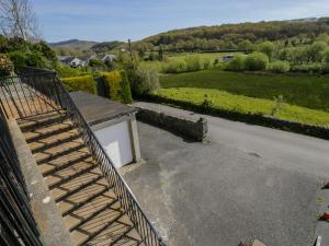 a set of stairs leading down to a driveway at Trem Y Foel in Penrhyndeudreath
